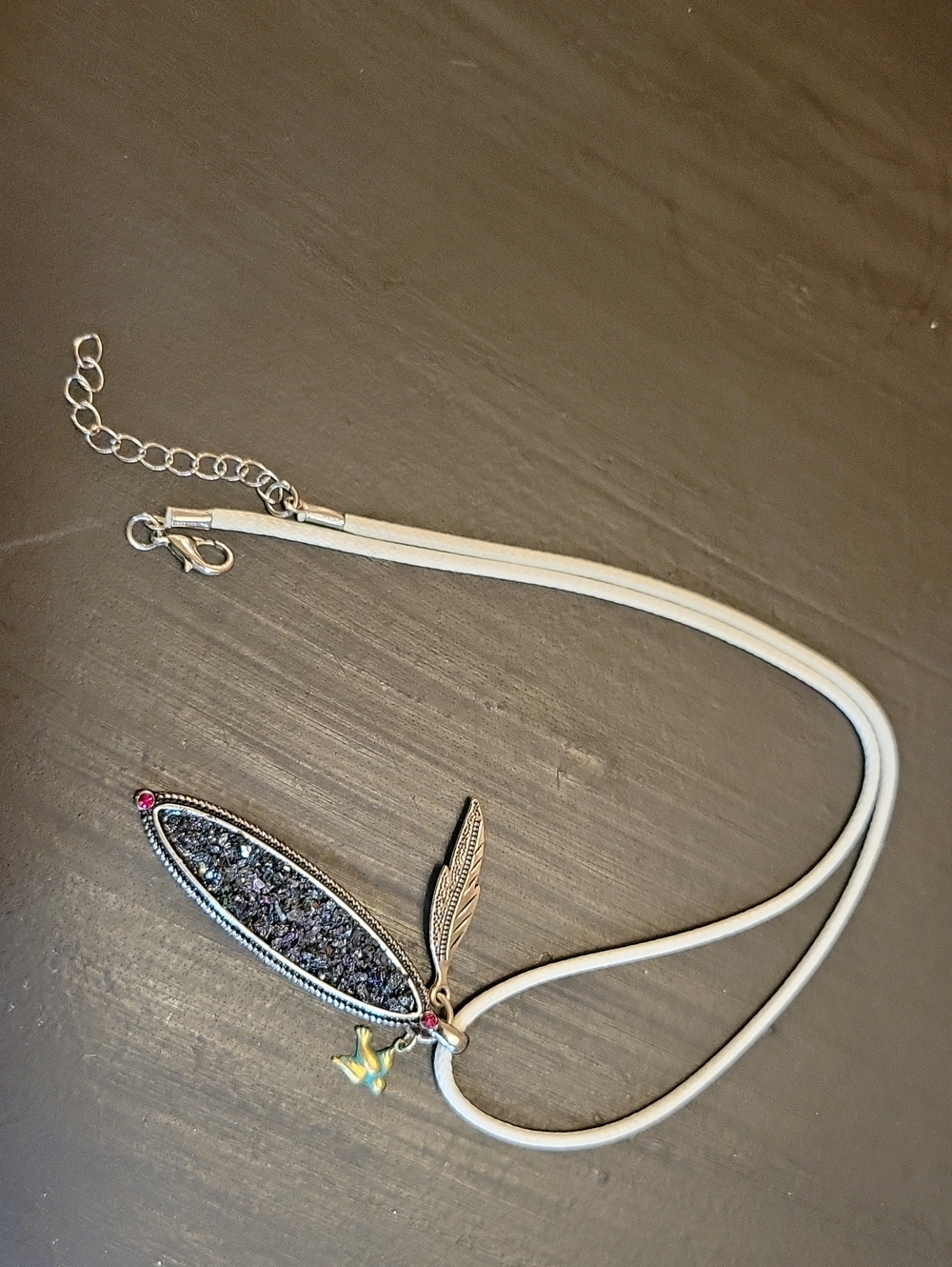 Sparkle Pendant With Bird And Feather